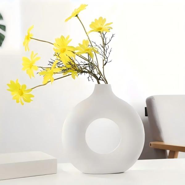 A round plastic vase is an artistic touch that suits your space. Add a touch of elegance and tranquility to your decor with this unique plastic vase.
