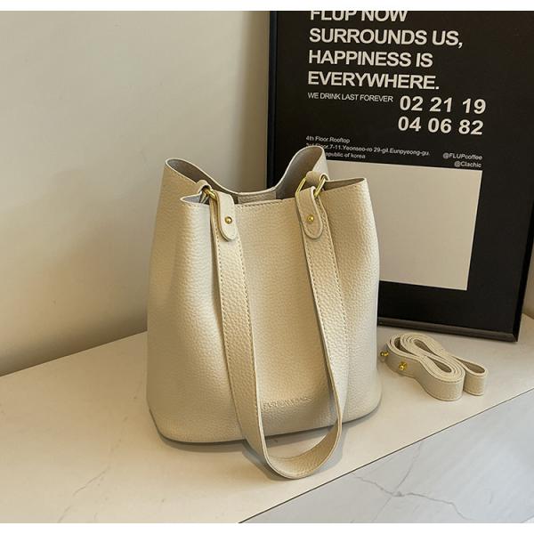 Bucket bags with a wallet are designed in a modern style that combines practicality and elegance. The bags feature a top drawstring design for easy closure.