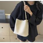 Bucket bags with a wallet are designed in a modern style that combines practicality and elegance. The bags feature a top drawstring design for easy closure.