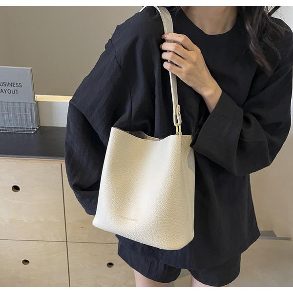 Bucket bags with a wallet are designed in a modern style that combines practicality and elegance. The bags feature a top drawstring design for easy closure.