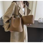 Bucket bags with a wallet are designed in a modern style that combines practicality and elegance. The bags feature a top drawstring design for easy closure.