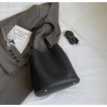 Bucket bags with a wallet are designed in a modern style that combines practicality and elegance. The bags feature a top drawstring design for easy closure.