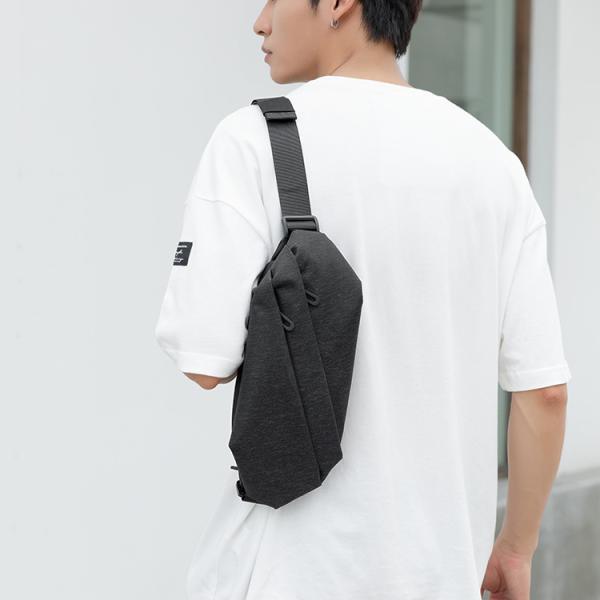 This crossbody bag features an innovative design and a stylish look. Made of durable material in a dark black color