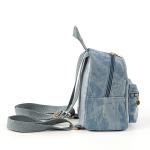 Small backpack and matching handbag in washed blue denim for a modern yet comfortable look.
