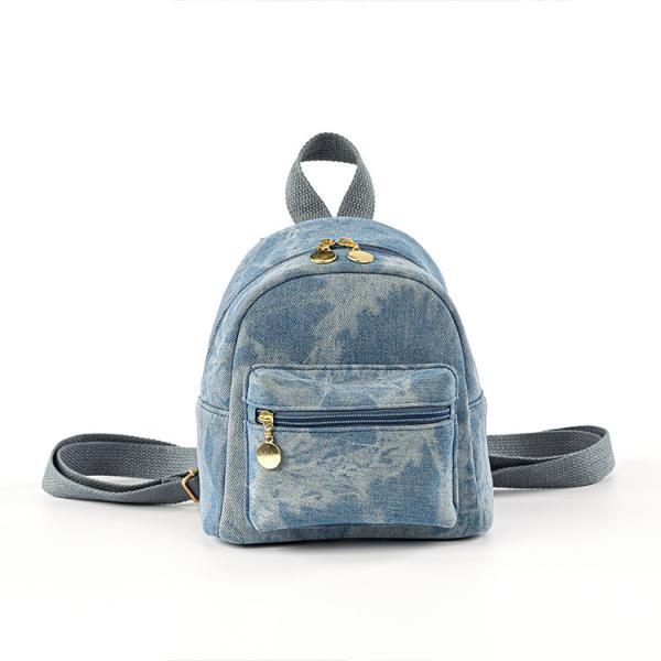 Small backpack and matching handbag in washed blue denim for a modern yet comfortable look.