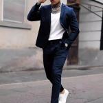 modern gray suit that combines formal and casual elegance. A blend of fabric and polyester materials.