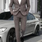 modern gray suit that combines formal and casual elegance. A blend of fabric and polyester materials.
