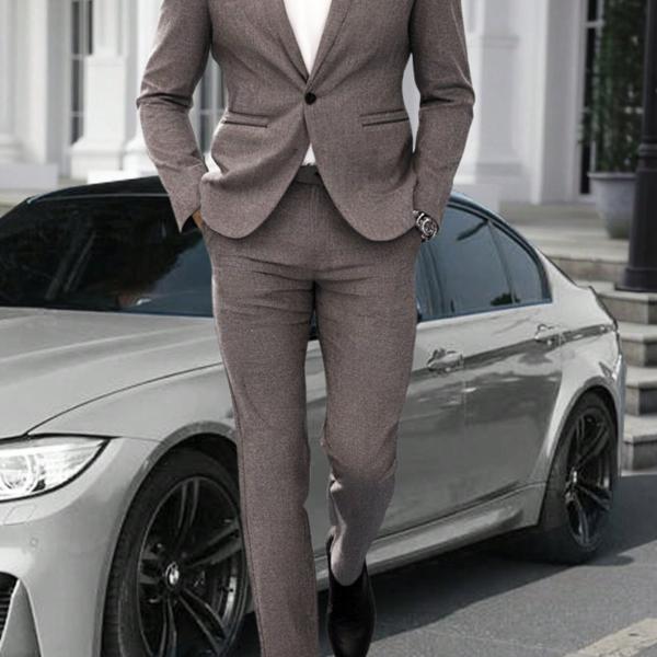 modern gray suit that combines formal and casual elegance. A blend of fabric and polyester materials.
