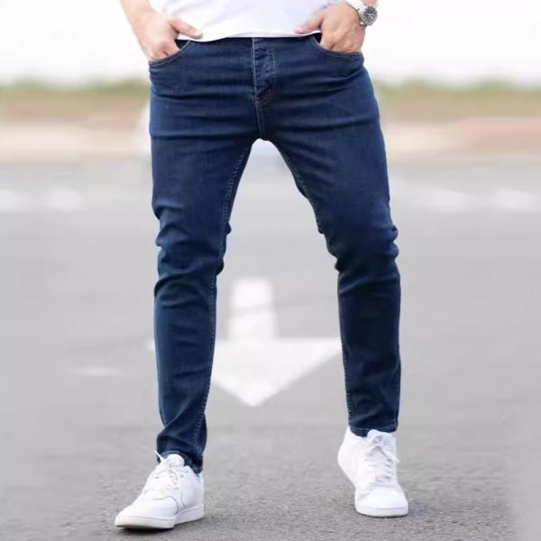 Dark navy skinny jeans highlight your figure and give you a modern look.