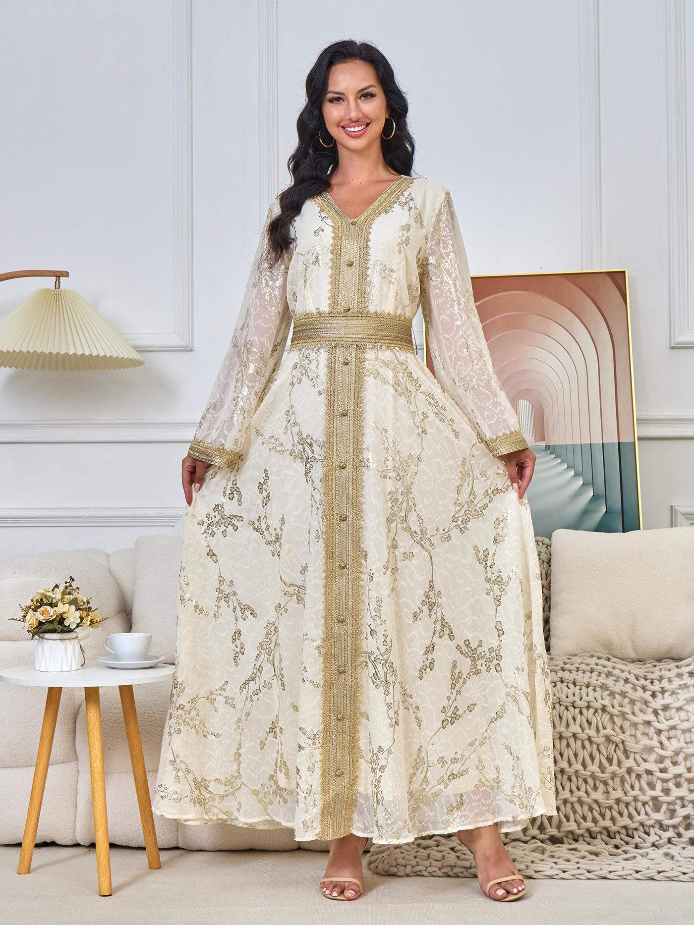 A long, loose, high-tech Moroccan caftan that drapes smoothly over the body, with a V-neckline that accentuates the look.