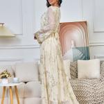 A long, loose, high-tech Moroccan caftan that drapes smoothly over the body, with a V-neckline that accentuates the look.