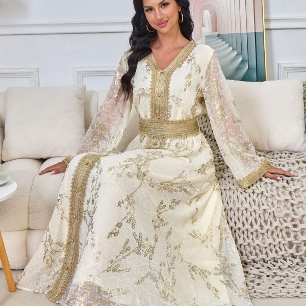 A long, loose, high-tech Moroccan caftan that drapes smoothly over the body, with a V-neckline that accentuates the look.