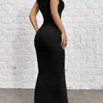 modern black dress designed with a flowing cut that highlights the beauty of the body. It comes without sleeves and has a high collar that adds a touch of elegance.