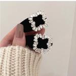 Velvet hair clip embellished with diamond crystals. Elegance that touches the imagination.