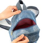 Small backpack and matching handbag in washed blue denim for a modern yet comfortable look.