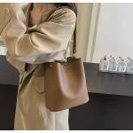 Bucket bags with a wallet are designed in a modern style that combines practicality and elegance. The bags feature a top drawstring design for easy closure.