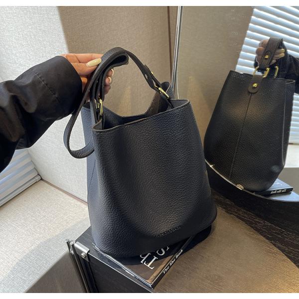 Bucket bags with a wallet are designed in a modern style that combines practicality and elegance. The bags feature a top drawstring design for easy closure.