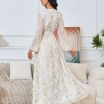 white dress embroidered with gold, a luxury that speaks of femininity