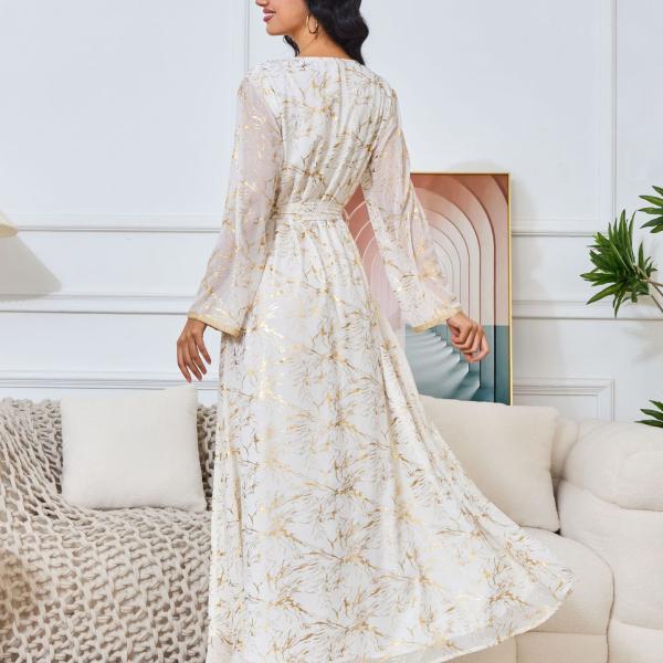 white dress embroidered with gold, a luxury that speaks of femininity