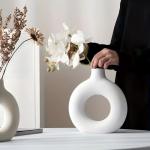 A round plastic vase is an artistic touch that suits your space. Add a touch of elegance and tranquility to your decor with this unique plastic vase.