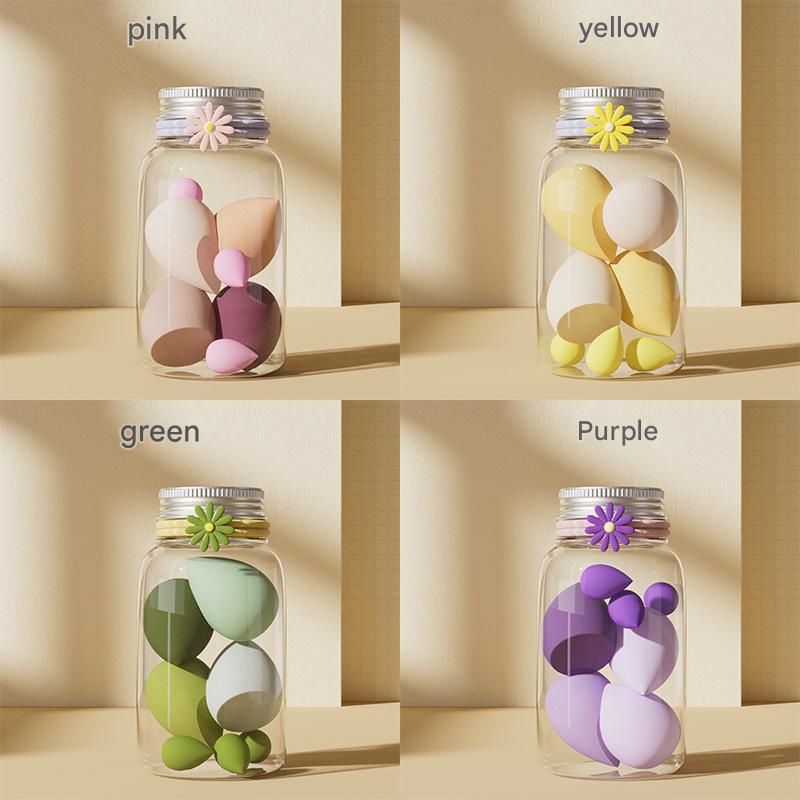 Luxury makeup sponge set in flower-decorated glass containers