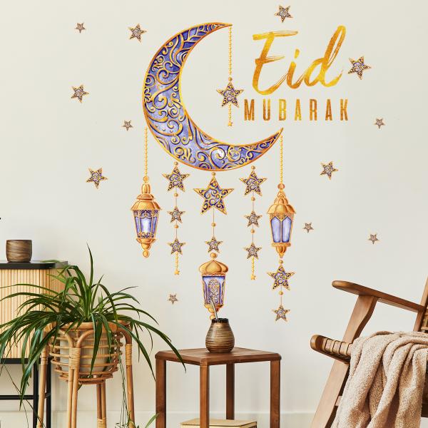 Crescent and lanterns wall decoration with the phrase Eid Mubarak