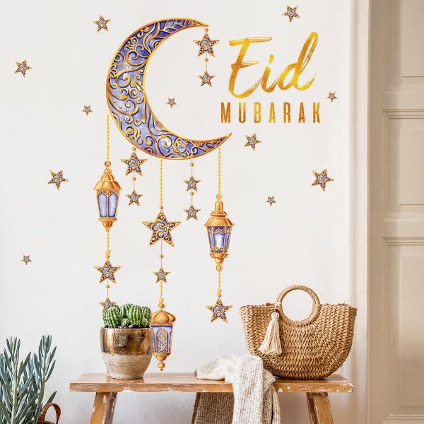 Crescent and lanterns wall decoration with the phrase Eid Mubarak