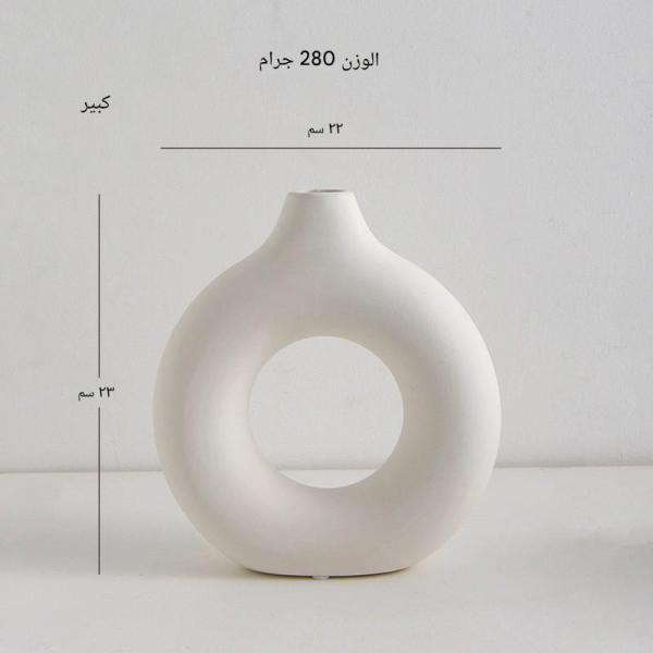 A round plastic vase is an artistic touch that suits your space. Add a touch of elegance and tranquility to your decor with this unique plastic vase.
